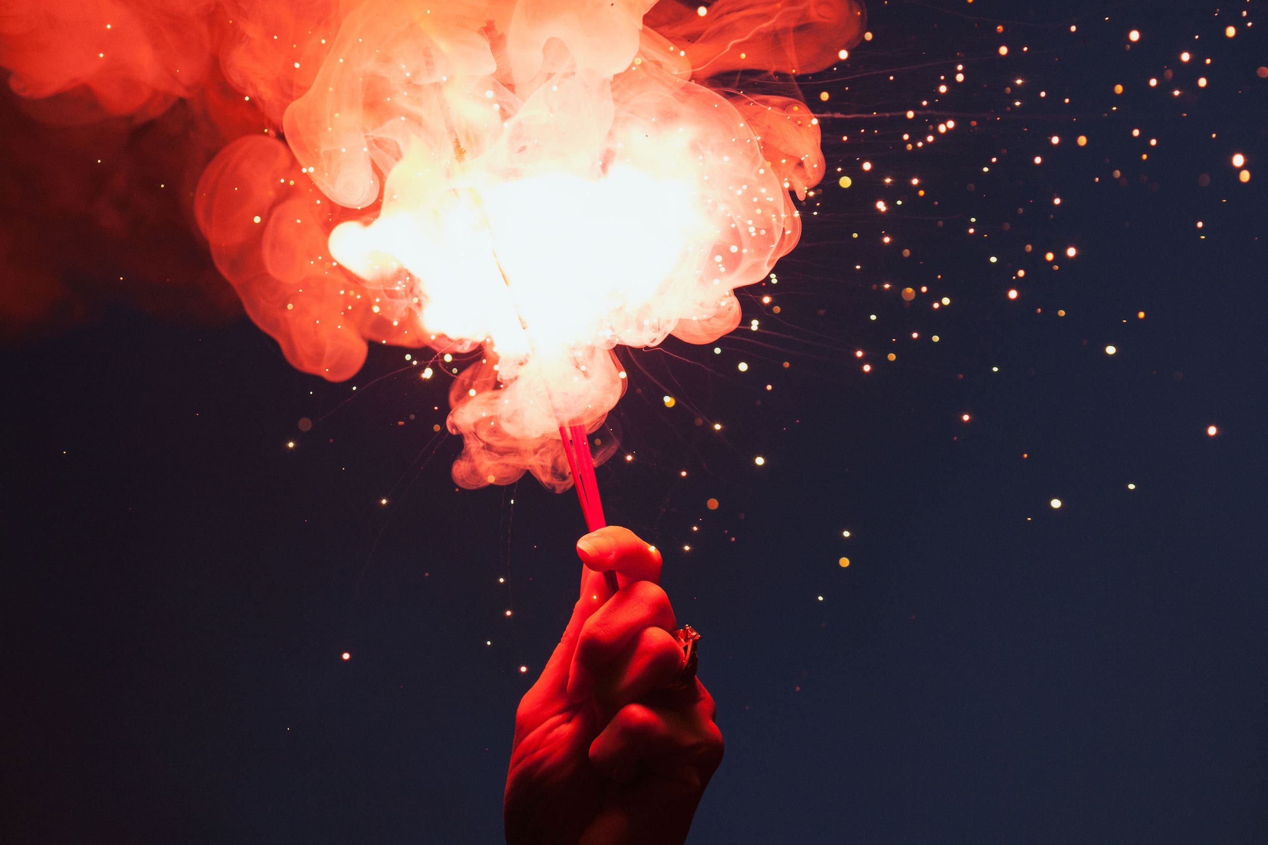 Sparkler being held in someones hand