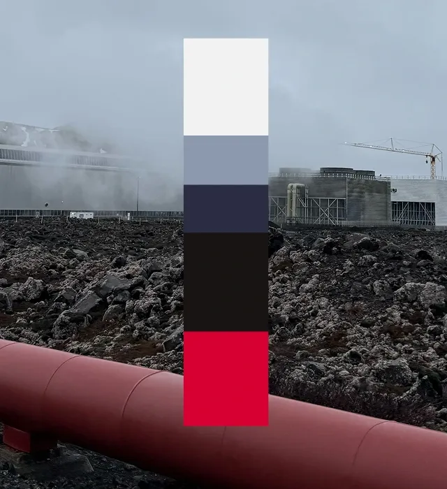 A vertical stack of five brand colors on a blurred industrial landscape background showing geothermal infrastructure. From top to bottom the colors are a very light off-white, a muted cool blue-grey, a deep navy blue, a dark charcoal black, and a vibrant red accent at the bottom. The palette reflects HS Orka’s visual identity, with the red echoing geothermal pipes and the darker and neutral tones suggesting earth, sky, and engineered structures.